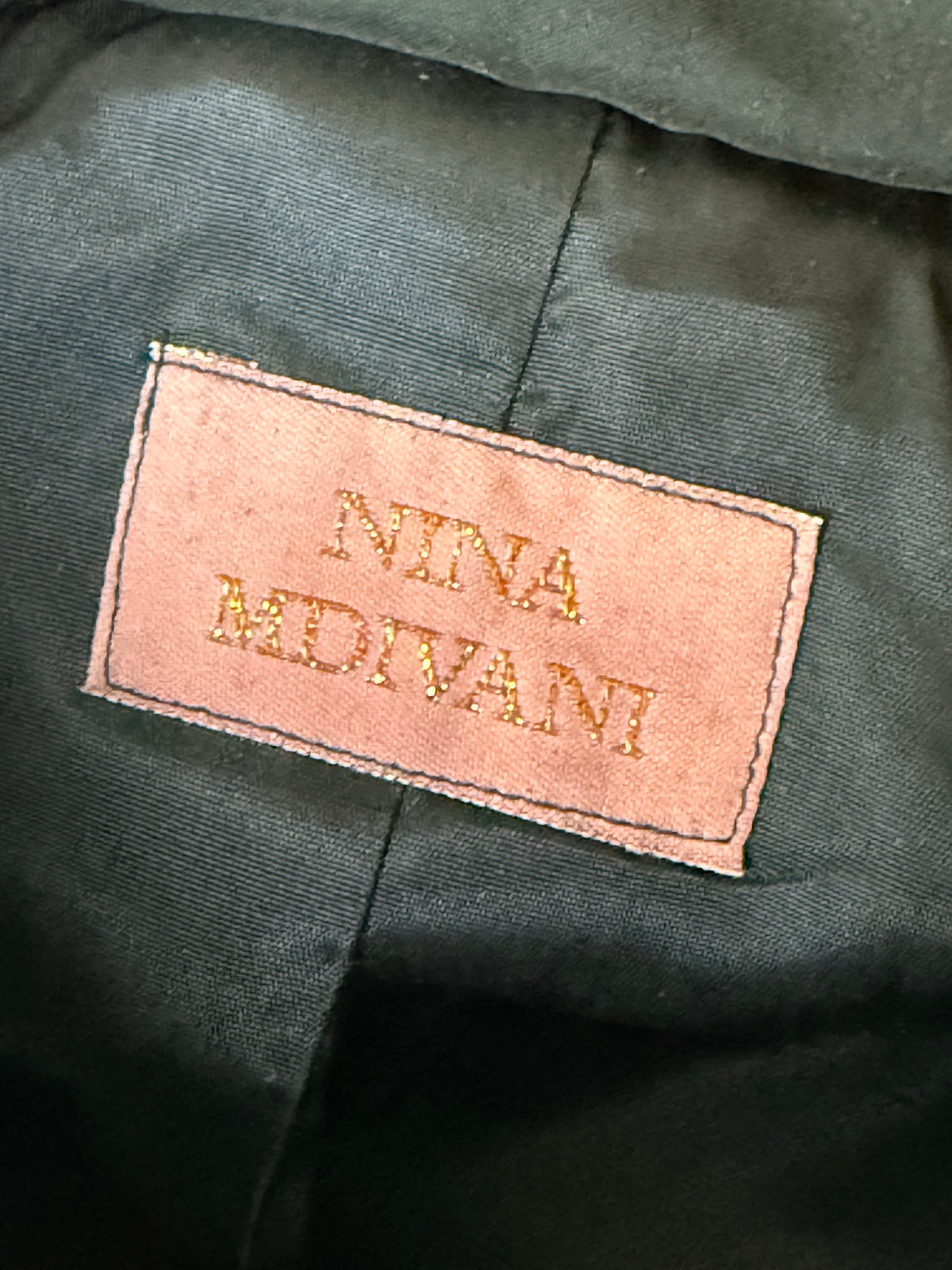 Nina Midvani brand label
