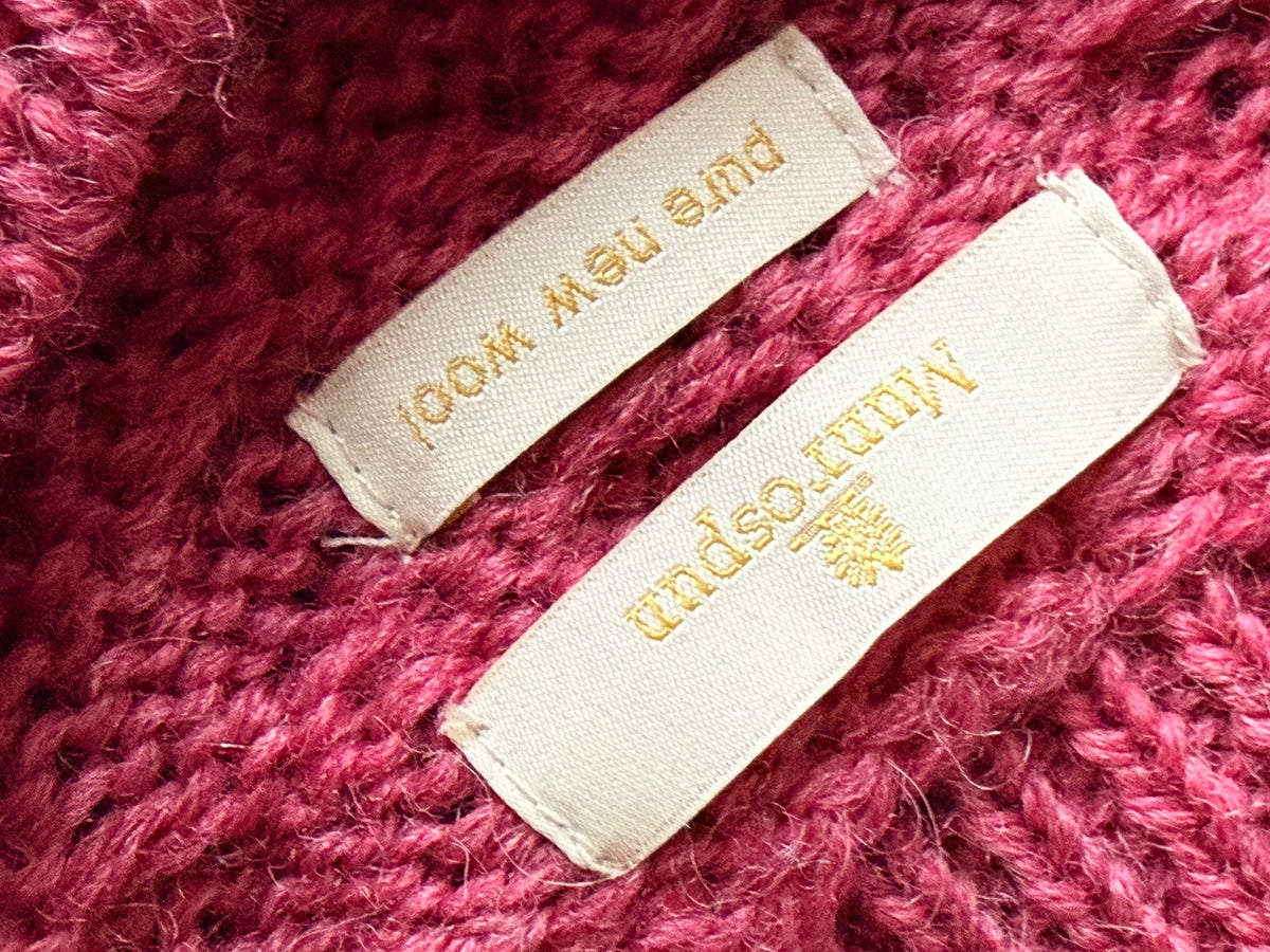 Munrospun rose pink wool cable-knit sweater label
