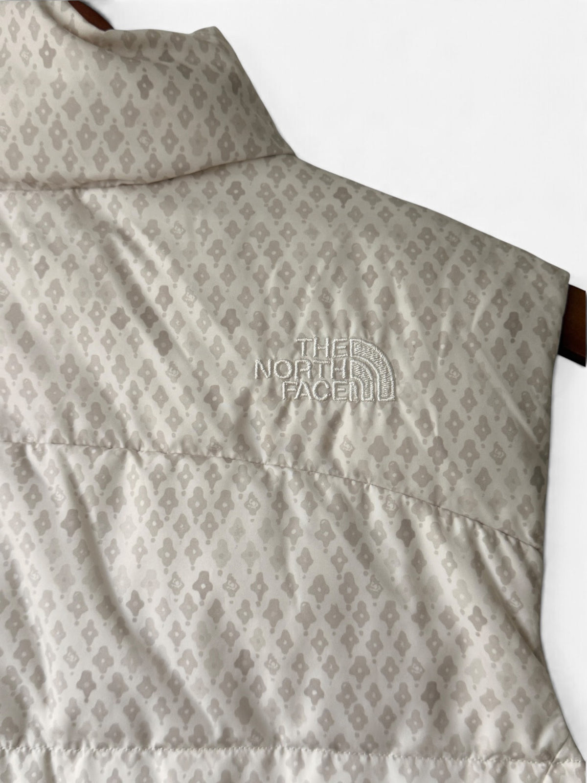 The North Face cream down puffer vest photo