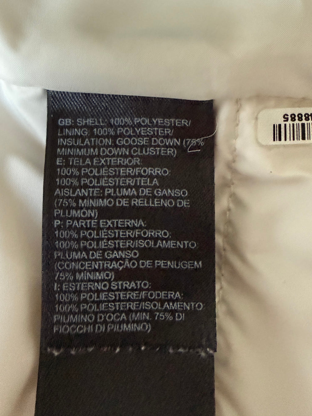 The North Face cream down puffer vest label