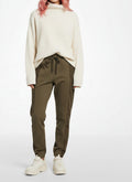 Full body view of the model wearing Haider Ackermann Olive Drop-Crotch Cotton Sweatpants Small