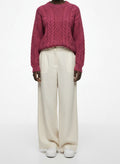 Full body view of the model wearing Munrospun Rose Pink Pure New Wool Cable-Knit Sweater Small