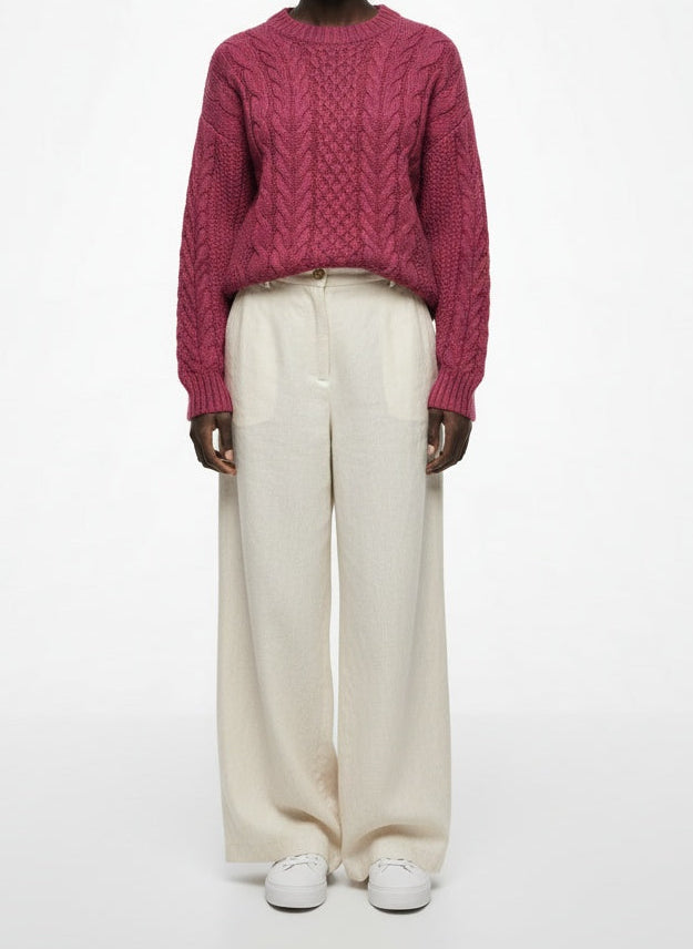 Full body view of the model wearing Munrospun Rose Pink Pure New Wool Cable-Knit Sweater Small