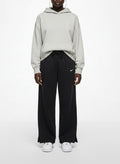 Full body view of the model wearing Nike Black Wide-Leg Fleece Sweatpants Small