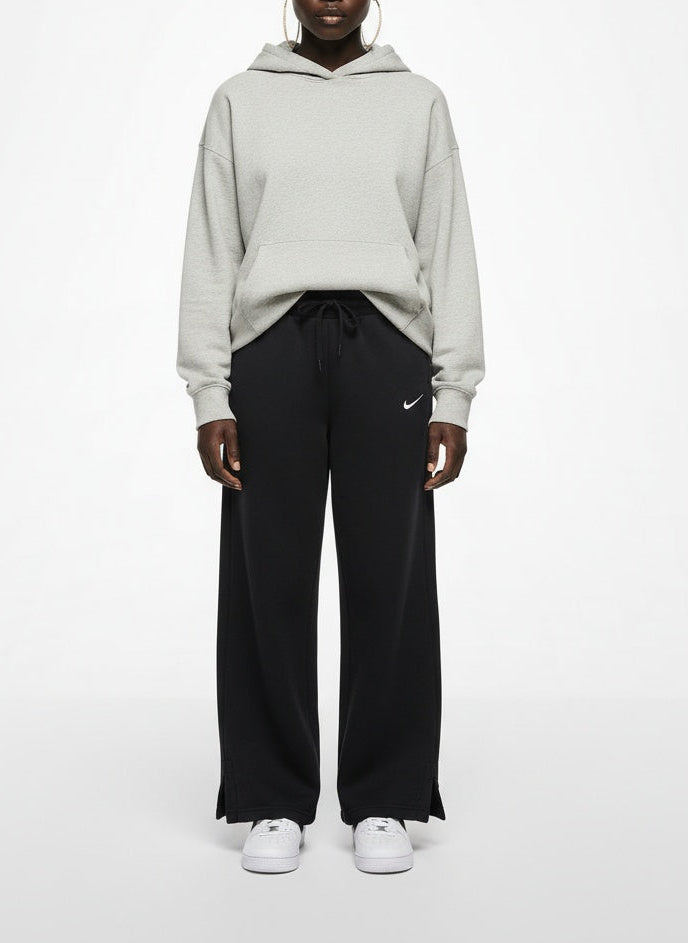 Full body view of the model wearing Nike Black Wide-Leg Fleece Sweatpants Small