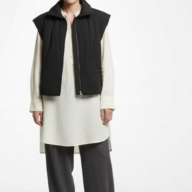 Full body view of the model wearing Nina Midvani Black Zip-Front Padded Vest Size 10