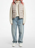 Full body view of the model wearing The North Face Cream Down Puffer Vest Women's Medium