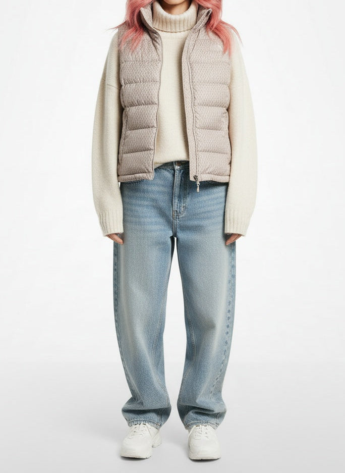 Full body view of the model wearing The North Face Cream Down Puffer Vest Women's Medium