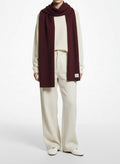 Full body view of the model wearing Aritzia Burgundy Cashmere Scarf