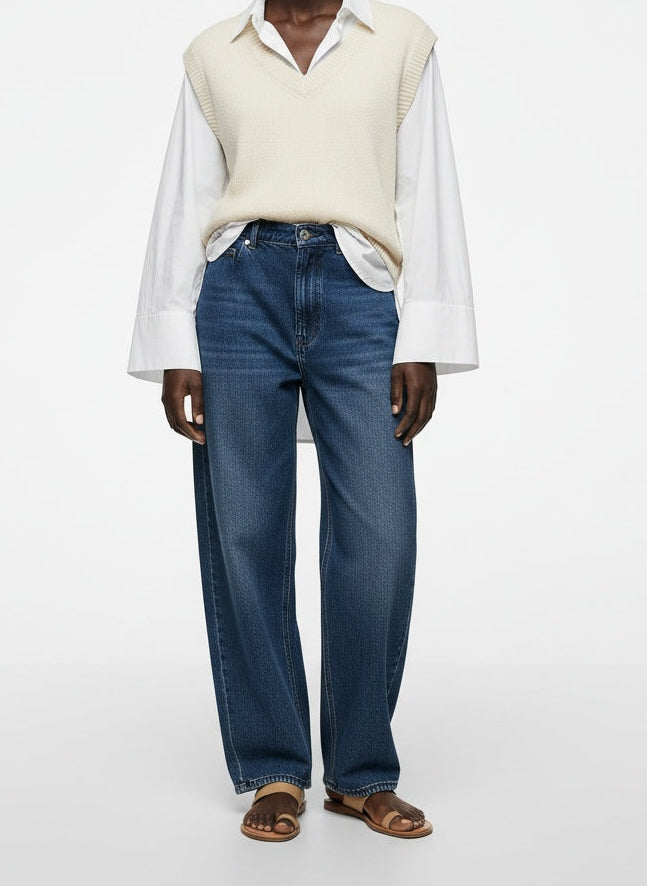 Full body view of the model wearing Denim Forum Barrel-Leg High-Rise Jeans Medium Wash